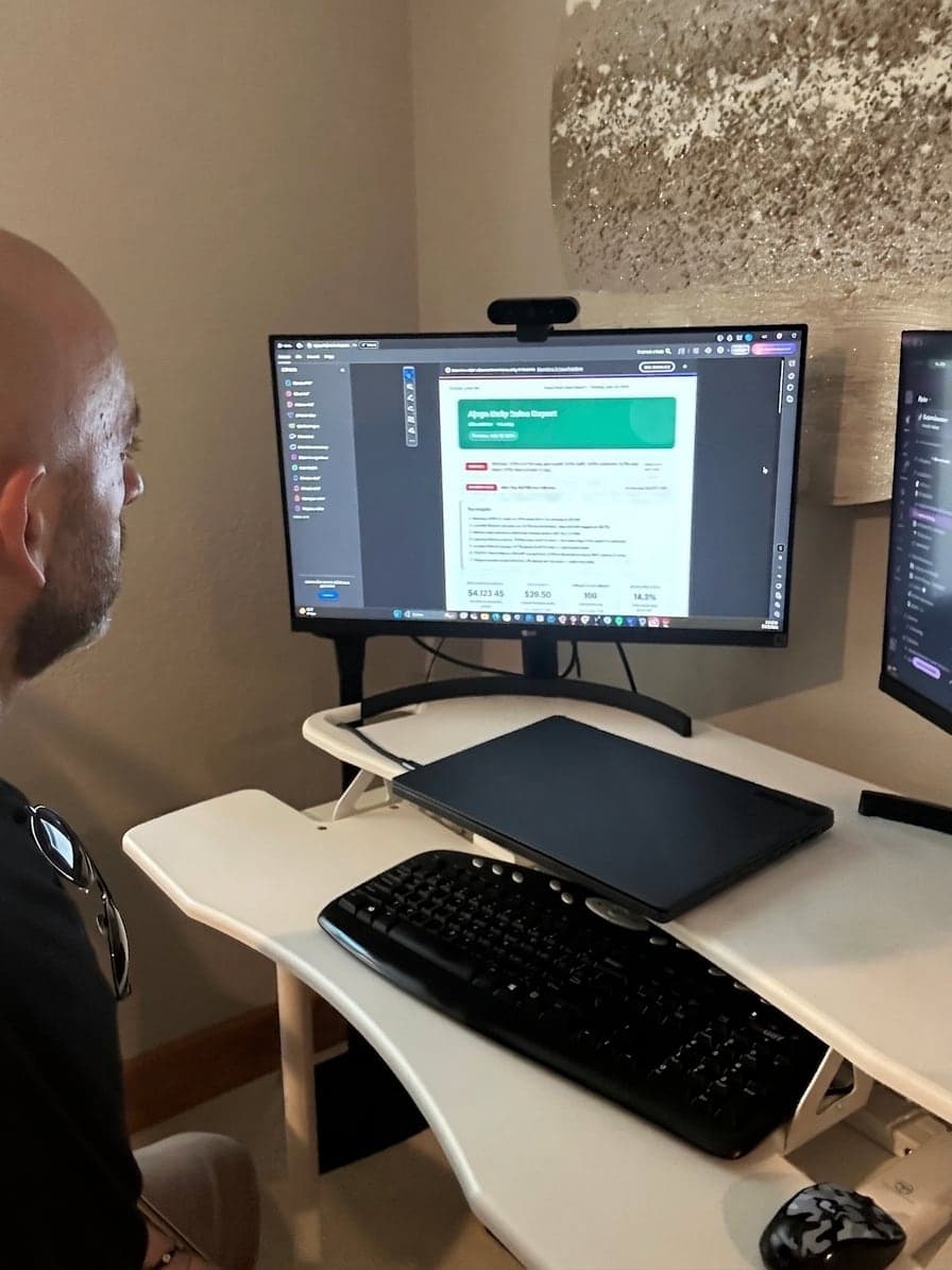 Joey Gindi at his desk reviewing the daily sales report his systems produce