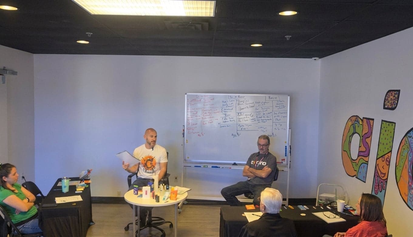 Joey Gindi teaching a workshop at the whiteboard in the Ajoya workshop room